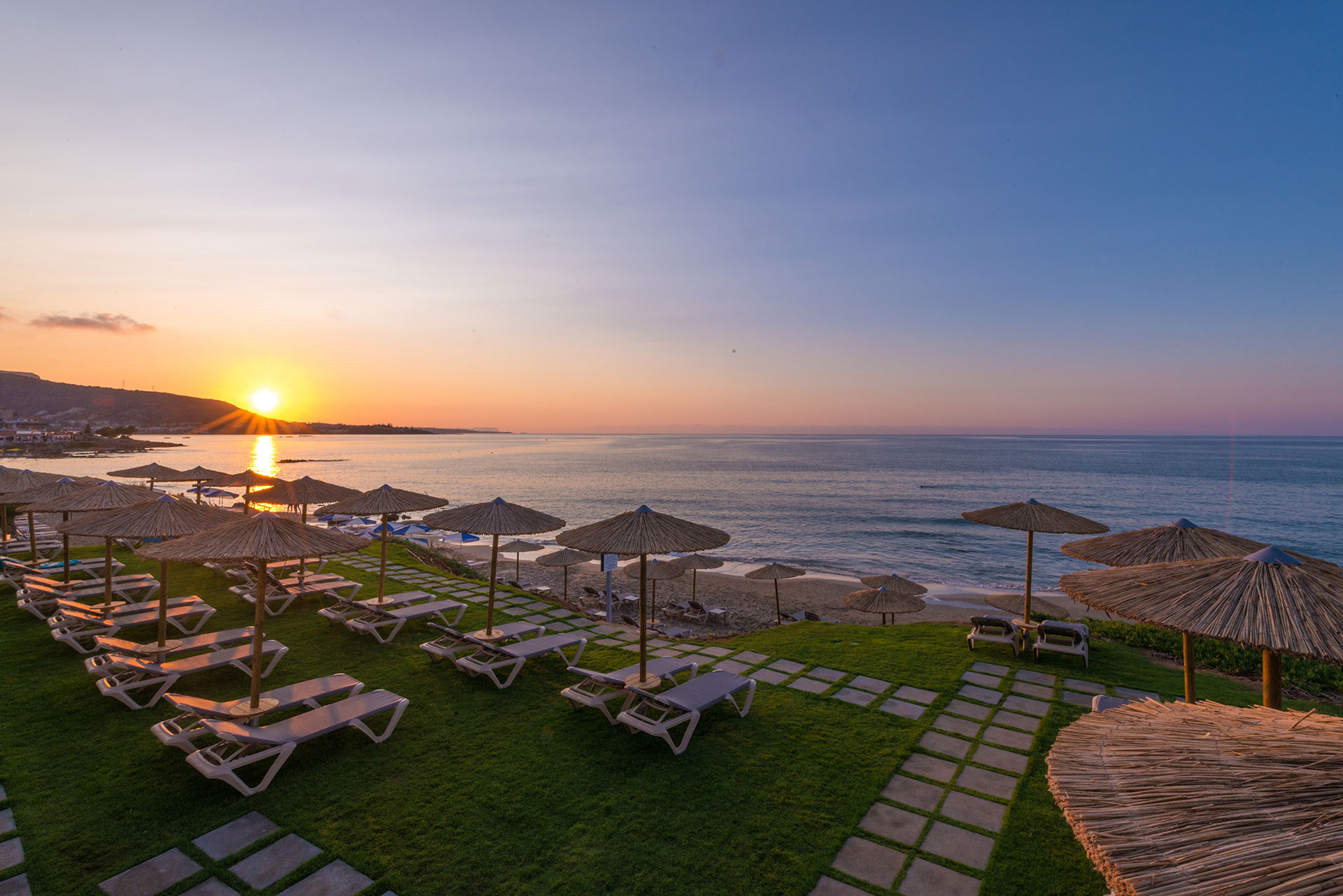 Beach bar sunbeds and umbrellas