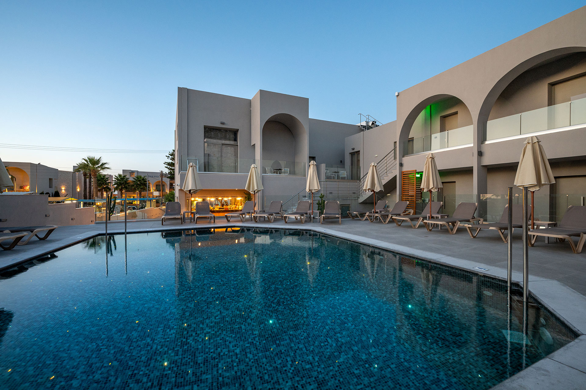 Annex pool bar sunbeds, closed umbrellas and the pool